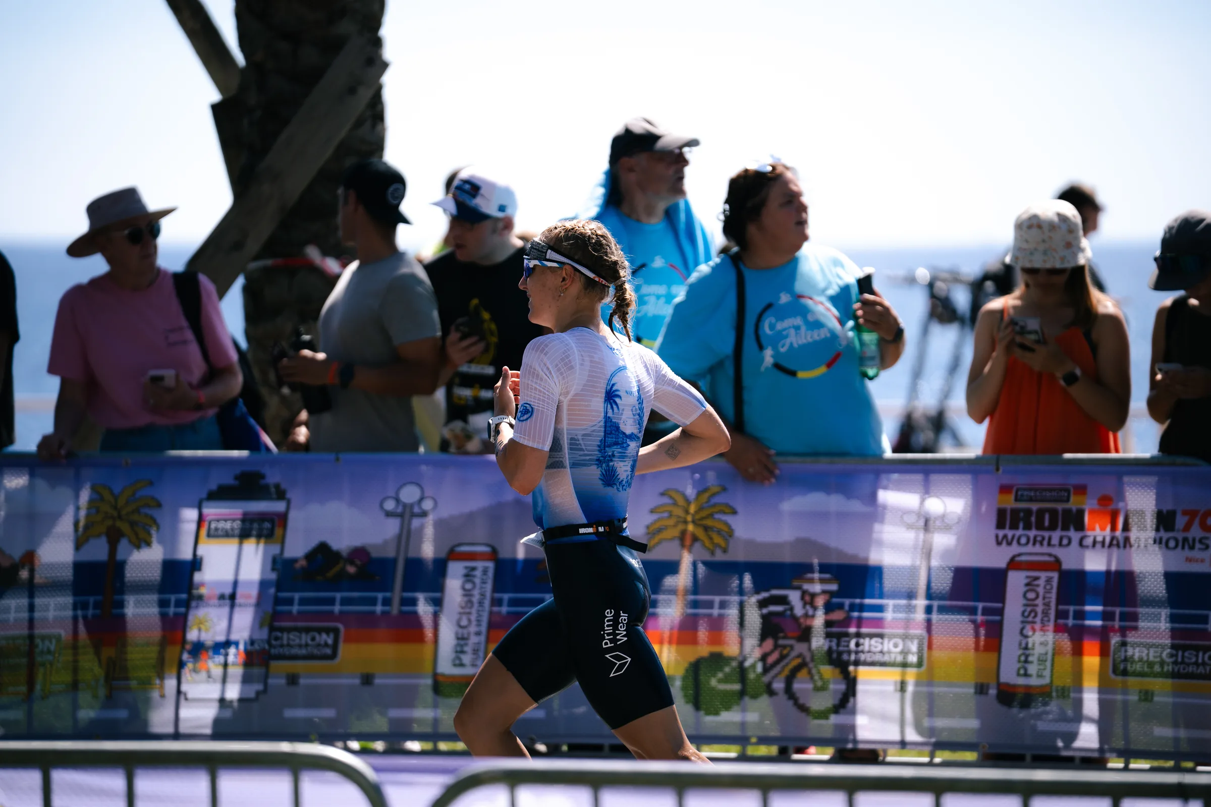 Emily Bogen in her Prime Wear tri suit on the run course of the IRONMAN 70.3 World Championship in Nice
